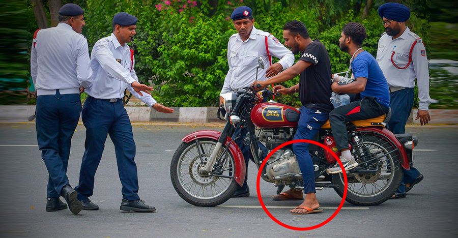 Man Riding Royal Enfield Classic While Wearing Chappals Featured