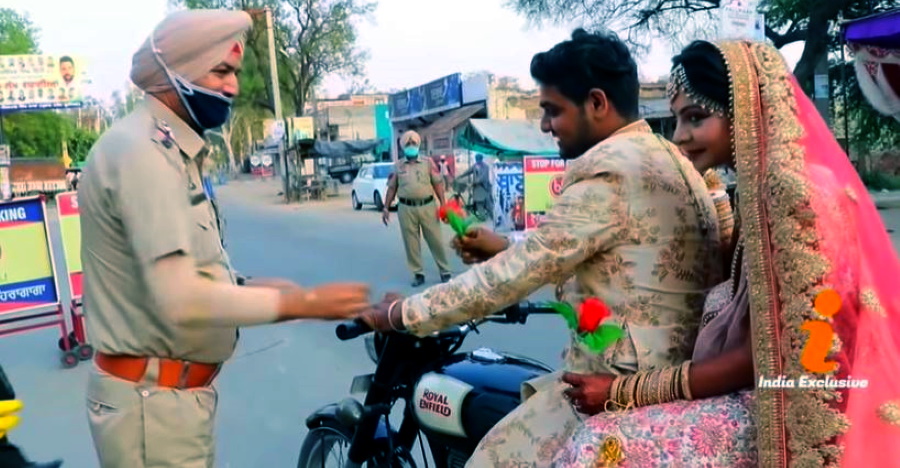 Newly-wed couple ride back on a Royal Enfield after simple wedding: Cops gift them [Video]