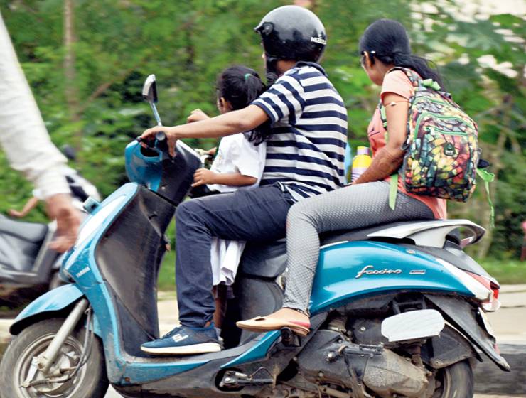 Travelling with a child without a helmet? You can get a challan