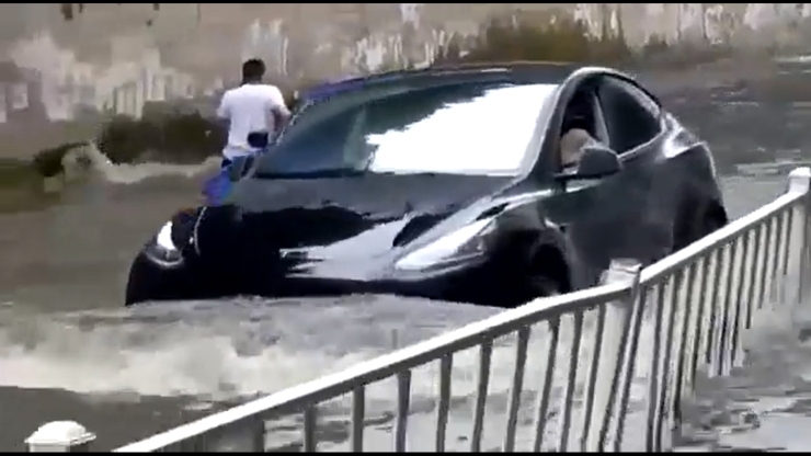 Watch Tesla Model Y cross a flooded road while BMW gets stuck