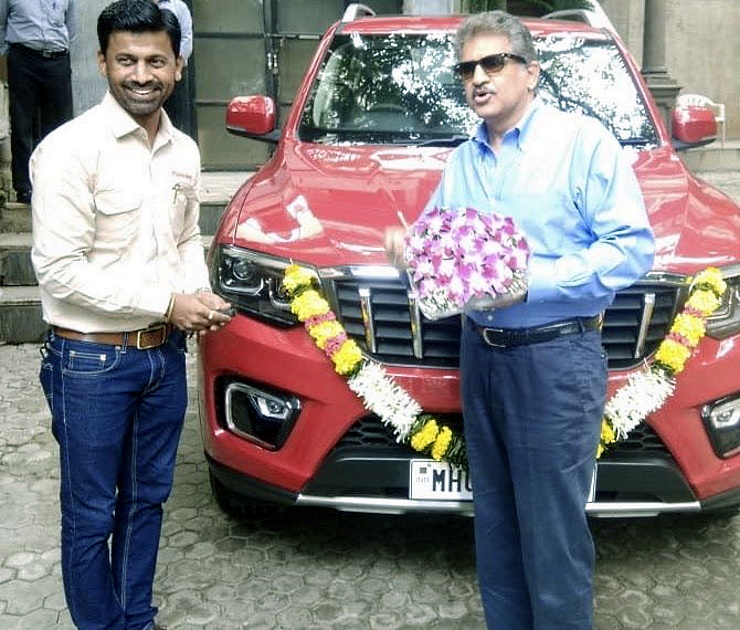 Anand Mahindra & the Mahindra SUVs he owns