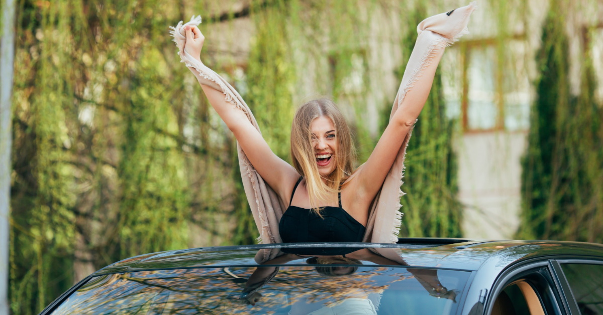Affordable cars with sunroof featured image - woman and sunroof