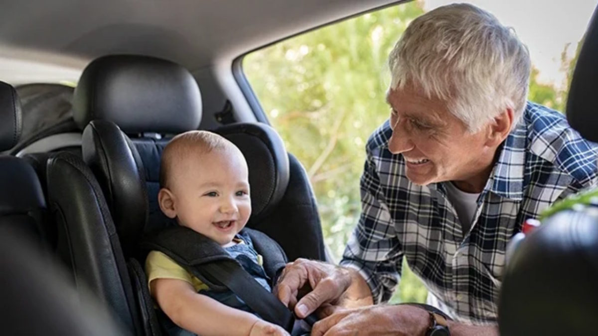 elder person with car child seat and kids