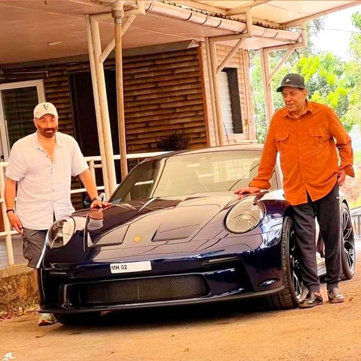 Sunny Deol and father Dharmendra pose with their newest Porsche – a 911 GT3