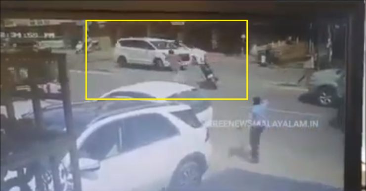 Innova Crysta starts rolling back after driver forgets to engage handbrake: Biker jumps in and stops car [Video]