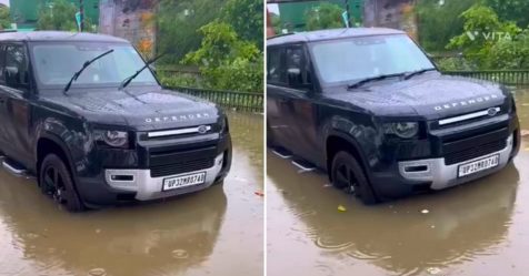 Land Rover defender stranded in water