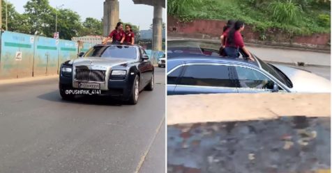 Girl's standing out of Rolls Royce's sunroof