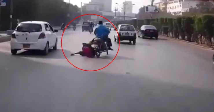 Woman pillion rider’s clothes get caught in motorcycle’s wheel: Falls on road with child [Video]