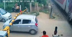 Maruti Alto driver jumps railway crossing: Gets stuck under barrier (Video)