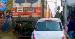 Maruti Swift Has A Narrow Escape; Gets Stuck Between Passing Train And Railway Gate [Video]