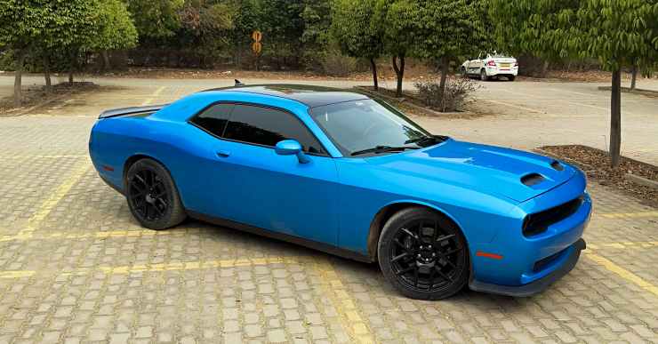 Dodge Challenger brought via Carnet does DONUTS in a parking lot [Video]
