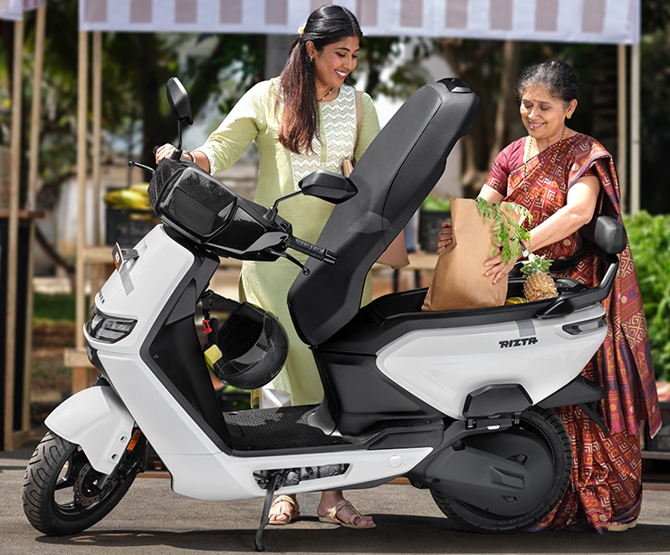 2 women with Ather Rizta scooter