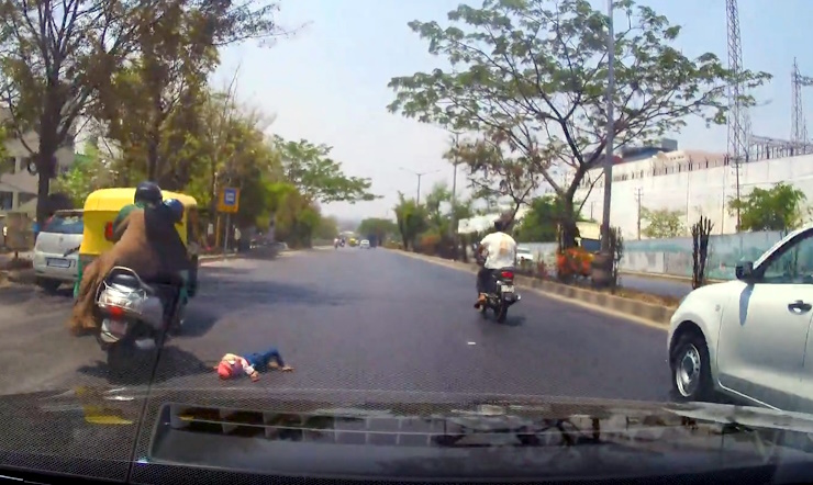 Child falls from scooter on to road in India, caught on dashcam