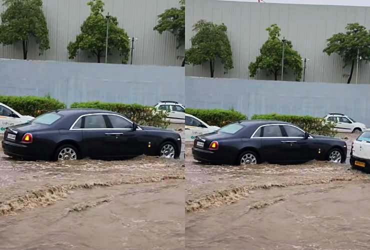 Rolls Royce Ghost stuck in flooded raod