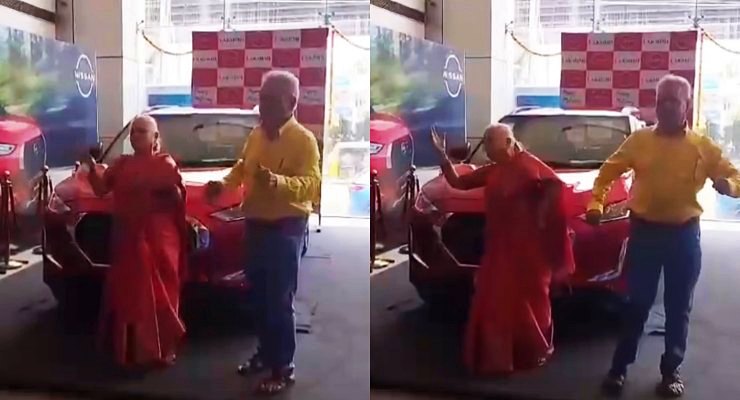 Couple dancing while taking delivery of Nissan Magnite